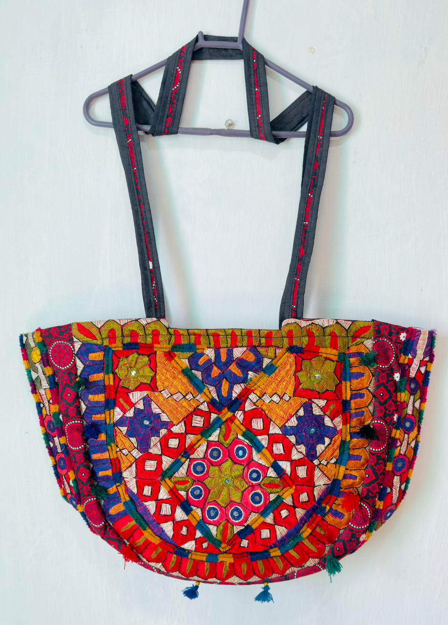 Sindhi half-moon mirror-work bag with patchwork embroidery