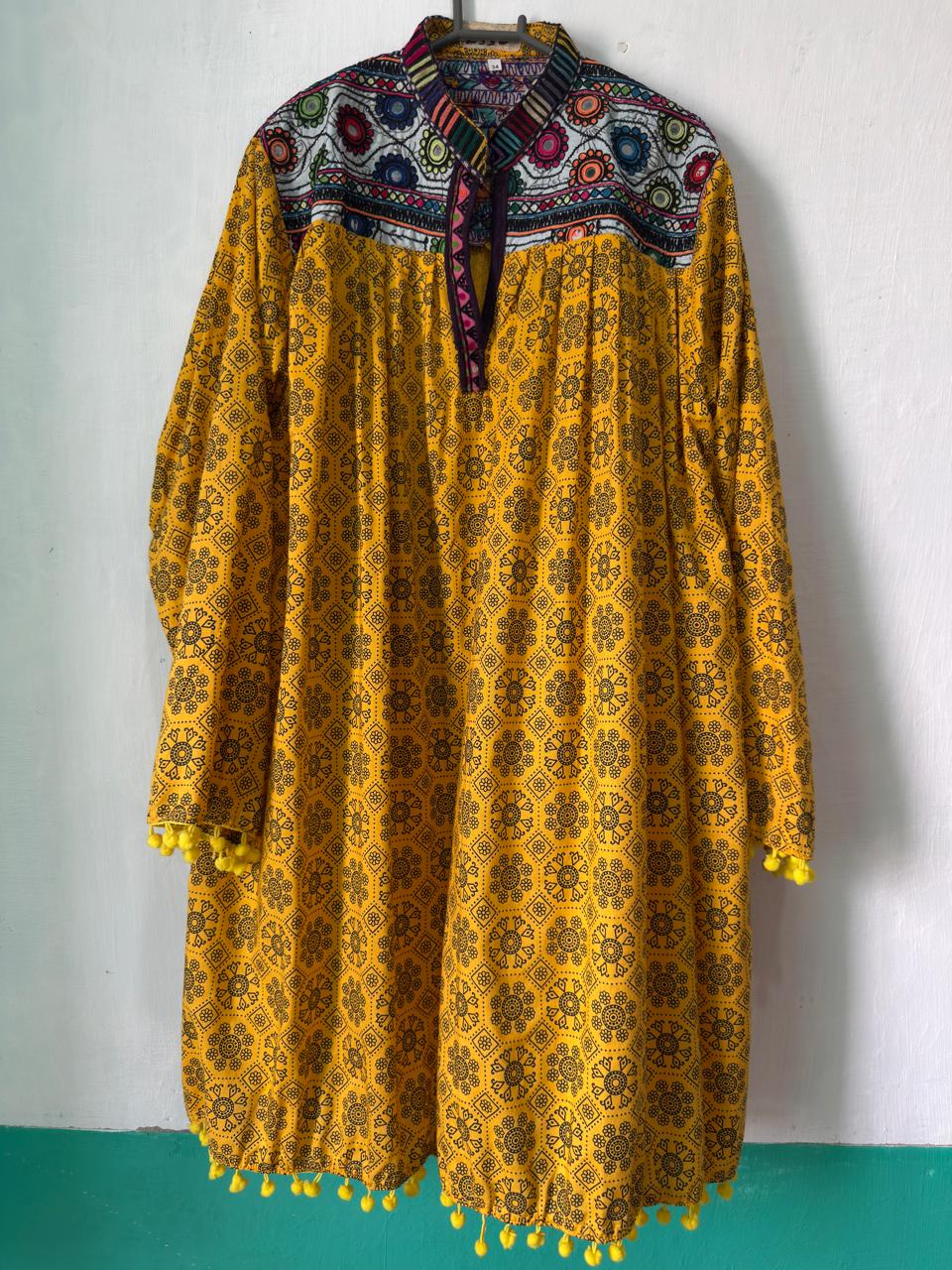 Sindhi embroidered frock kurta in mustard gold with decorative hem