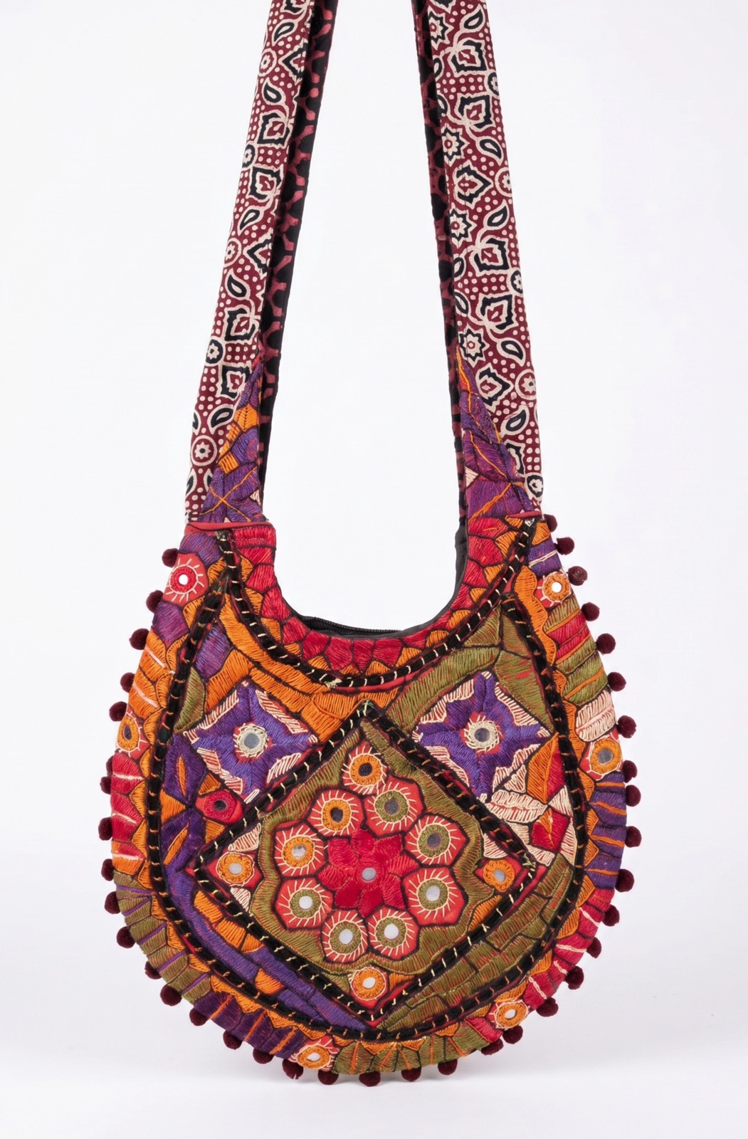 Round patchwork mirror-work crossbody shoulder bag in jewel tones, handmade in Tharparkar, Sindh
